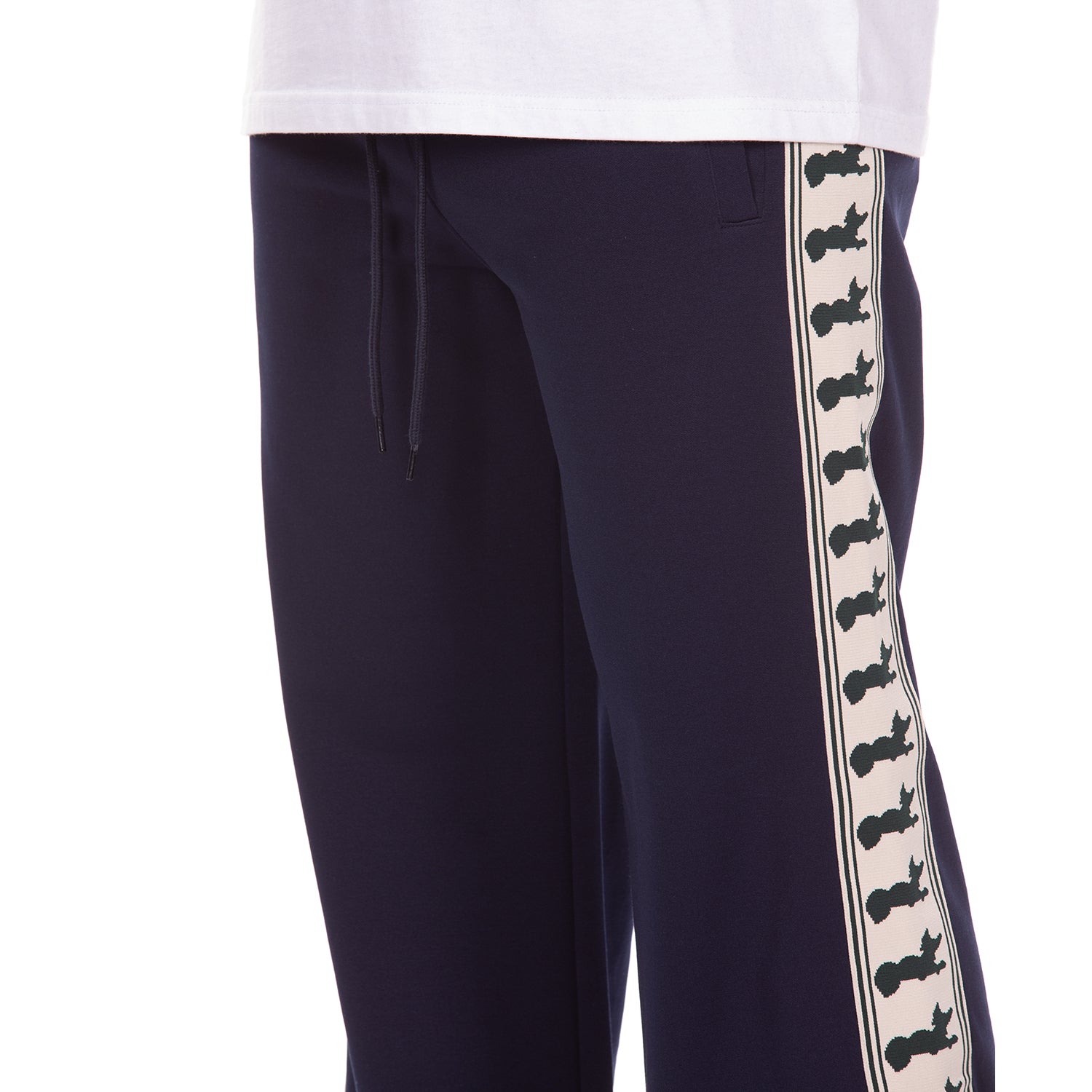 Navy track pants with a decorative white stripe featuring navy graphics on a white background.