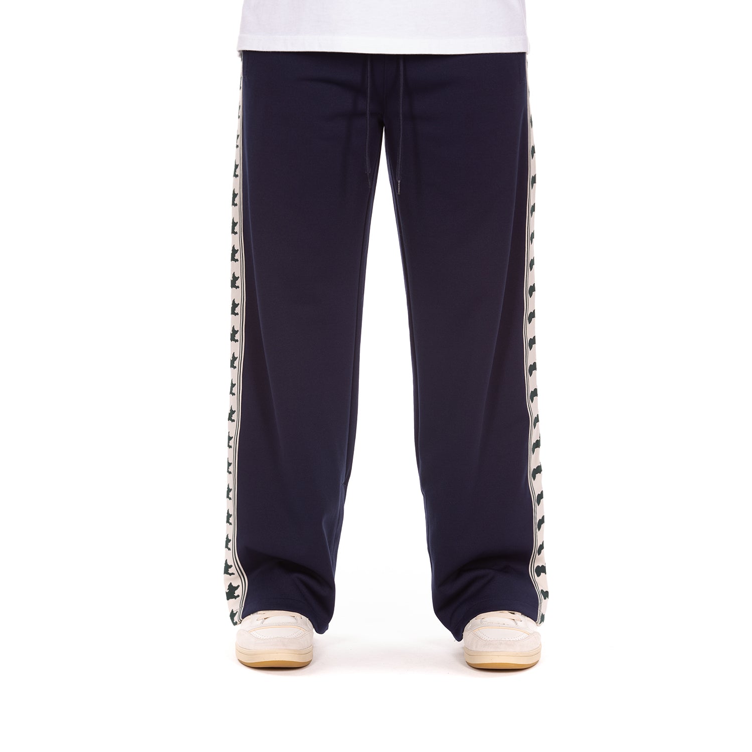 Navy track pants with a decorative white stripe featuring navy graphics on a white background.