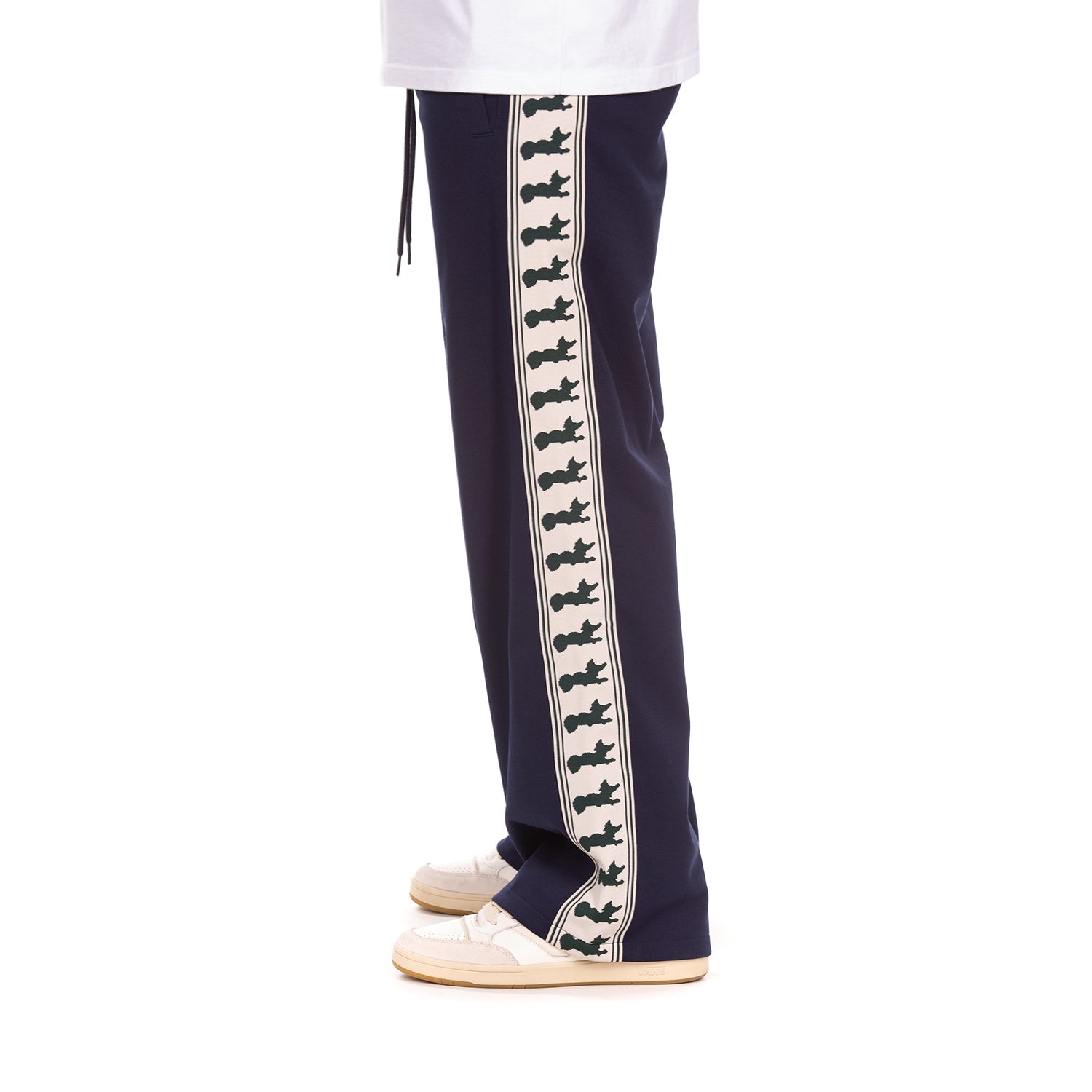 Navy track pants with a decorative white stripe featuring navy graphics on a white background.