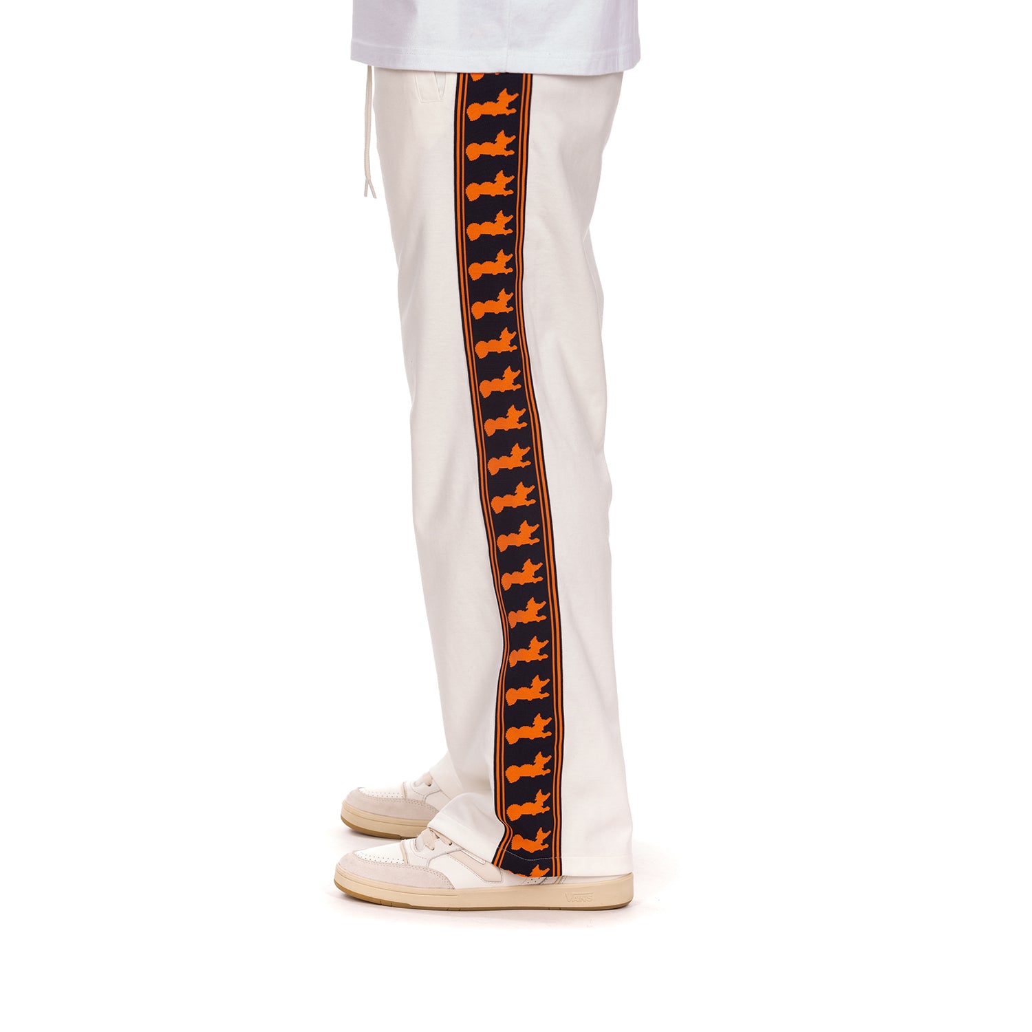 White pants with orange and navy striped sides on a white background