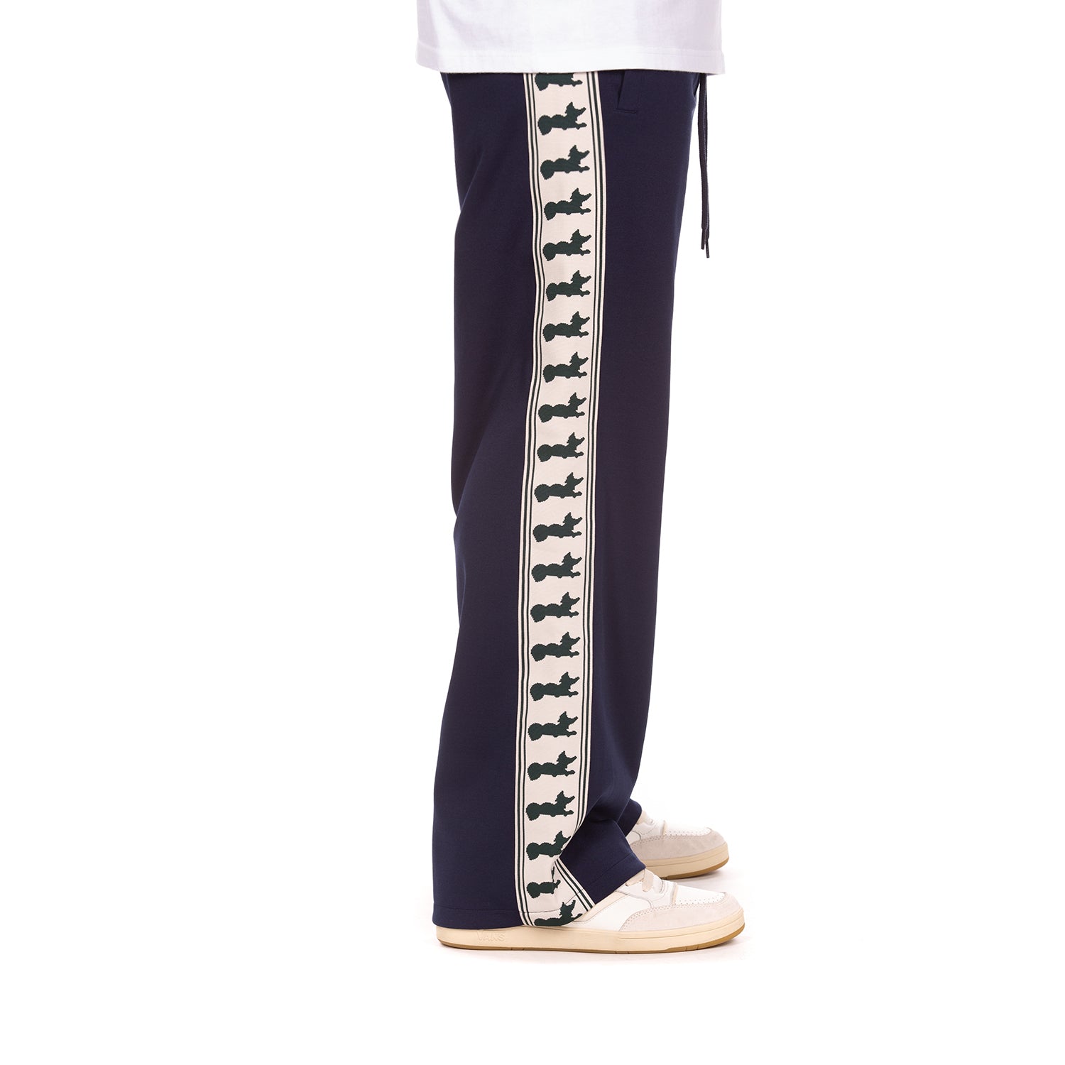 Navy track pants with a decorative white stripe featuring navy graphics on a white background.